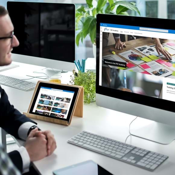 Desk top with person working